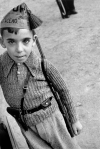 Spanish Civil War, Barcelona 1936. The boy is wearing a cap of the Steel Battalions, of the Union de Hermans Proletarios (Union of Proletarian Brothers), an anarchist militia.